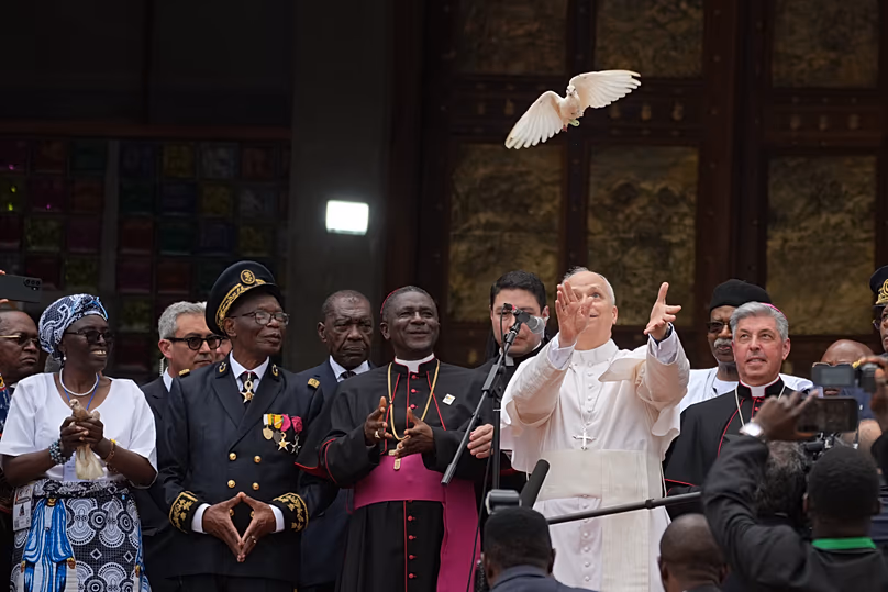 Pope Leo XIV with the Archbishop Andrew Nkea Fuanya frees a white dove at Saint Joseph's Cathedral in Bamenda, Cameroon, 16 April 2026